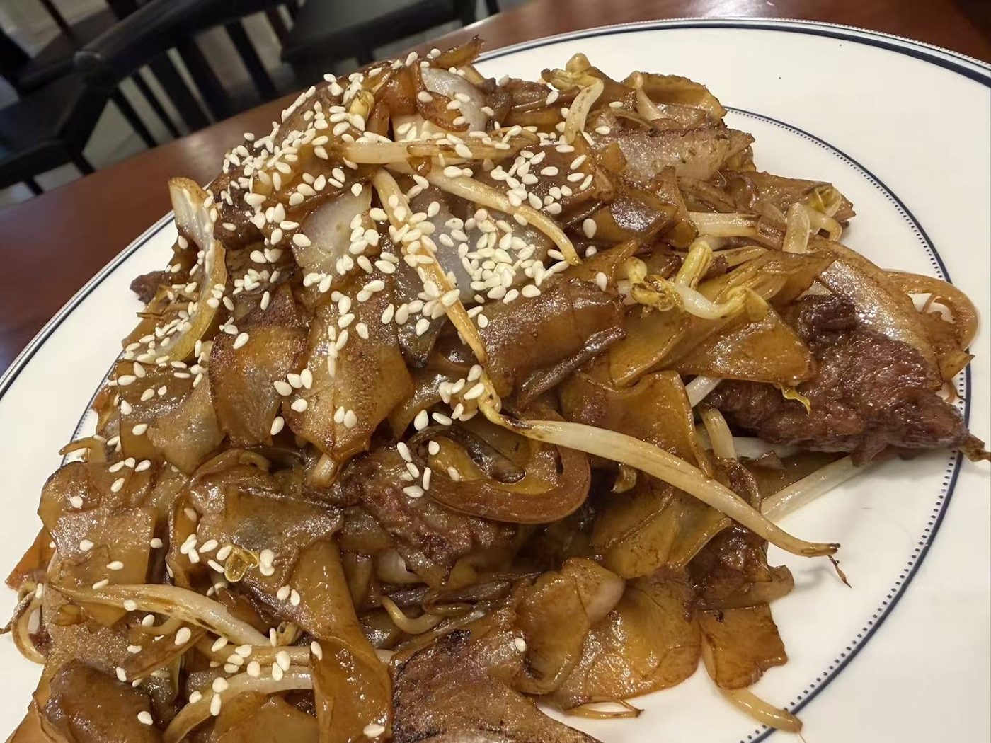 Beef chow fun with bean sprouts and sesame